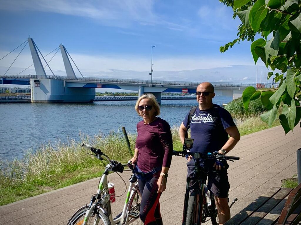 hosts on bikes with bridge