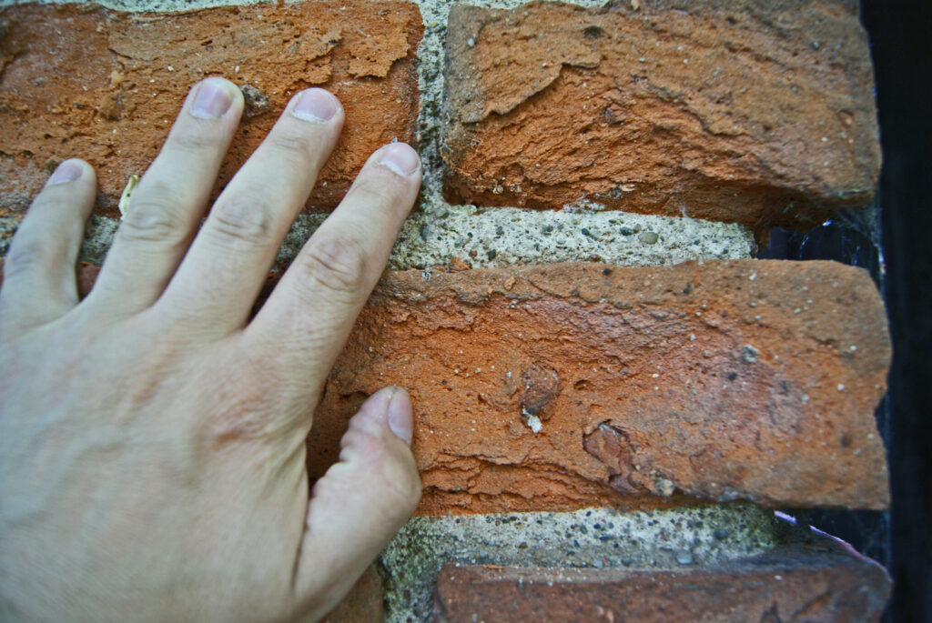 hand on brick